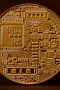 One new golden physical bitcoin is lies on dark wooden backgound, close up. High resolution photo. Cryptocurrency mining concep