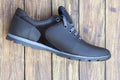One new, leather, men`s, sports black shoes on laces.