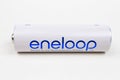 One new Panasonic Eneloop rechargeable white AA battery on a light background. October 16, 2022 Balti Moldova