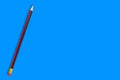 One new wooden graphite pencil with rubber eraser tip on blue background