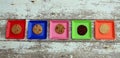 Five diffent colored square with plates with cookies Royalty Free Stock Photo