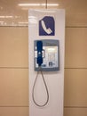 One obsolete telephone stand at airport store