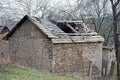 One old brown brick abandoned rural house with a destroyed wooden roof Royalty Free Stock Photo