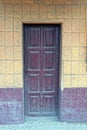 one old brown dirty wooden door on the wall Royalty Free Stock Photo