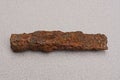 One old brown rusty iron pickaxe