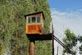 One old brown rusty iron tower observation post with a window Royalty Free Stock Photo