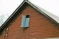One old brown wooden loft with a small window Royalty Free Stock Photo