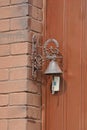 one old copper bell and bey plastic electric bell Royalty Free Stock Photo