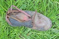 one old dirty leather torn black brown shoe Royalty Free Stock Photo