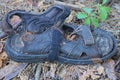 one old dirty rubber black sandal