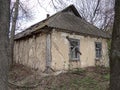 One old gray abandoned rural house with boarded up windows Royalty Free Stock Photo