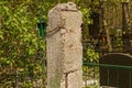 One old gray concrete pillar with rusty rebar stands on the street Royalty Free Stock Photo