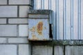 One old gray iron mailbox in brown rust on a wall Royalty Free Stock Photo