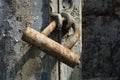 One old gray iron padlock in brown rust