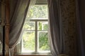 One old gray window with curtains in the room Royalty Free Stock Photo