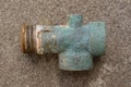 One old green brass nut plumbing adapter