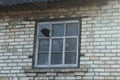 One old large square window with a broken window Royalty Free Stock Photo