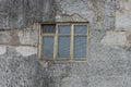 One old large window behind an iron lattice Royalty Free Stock Photo