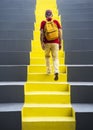 One old man of European nationality walks up the bright yellow steps, Solo Travellers