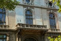 Old open concrete balcony on the wall with large windows Royalty Free Stock Photo