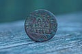 Old copper russian coin on a gray table