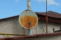 One old rusty satellite dish on the wall of a house Royalty Free Stock Photo