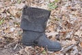 one old torn dirty rubber black boot Royalty Free Stock Photo