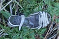 one old torn dirty white gray leather sandal Royalty Free Stock Photo