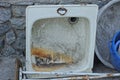 One old white metal dirty kitchen sink in rust Royalty Free Stock Photo