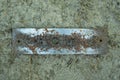 one old white rectangular iron plate in brown rust Royalty Free Stock Photo