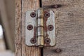 One old white small door hinge in brown rust Royalty Free Stock Photo