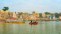 Pilgrims enjoying early sunrise boat ride on Ganga/Ganges river in Varanasi, India Royalty Free Stock Photo