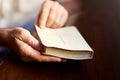 One on one time with the word of God. a man opening a bible. Royalty Free Stock Photo