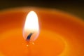 One orange aroma candle macro Royalty Free Stock Photo