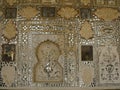 One of the ornately decorated walls in a room at the Amber fort in Jaipur, India