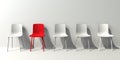 One out unique red chair concept with white chairs Royalty Free Stock Photo