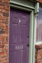 One outdoor purple wooden door