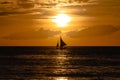 One outrigger sailboat on the horizon Royalty Free Stock Photo