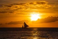 One outrigger sailboat on the horizon Royalty Free Stock Photo