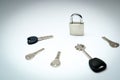 One padlock with many another keys. Many keys and one lock as concept. Different metal keys and one hinged steel padlock on a Royalty Free Stock Photo