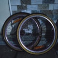 One pair of bicycle wheels and tires that are no longer used because they need repair