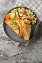 One Pan Breakfast Sandwich is the ultimate hack for busy mornings with egg, ham and cheese closeup on the plate . Vertical top Royalty Free Stock Photo