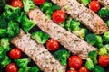 One pan dish baked salmon fillet with broccoli and tomato, horizontal, top view, closeup Royalty Free Stock Photo