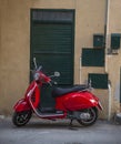 One parked red scooter close up Royalty Free Stock Photo