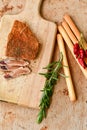 One partly cut piece and slices of cured pork and parmesan cheese Royalty Free Stock Photo