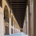 Passage surrounding the courtyard Ahmad Ibn Tulun Mosque with huge decorated arches, Cairo, Egypt Royalty Free Stock Photo