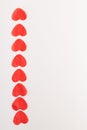 One path is lined with paper hearts of red color on a white background. Elements for design and inscription Royalty Free Stock Photo
