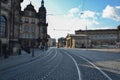 One of the paved streets in Dresden with a tram in the background