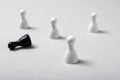 One pawn standing out from others on table Royalty Free Stock Photo