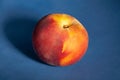 One peach on blue Royalty Free Stock Photo